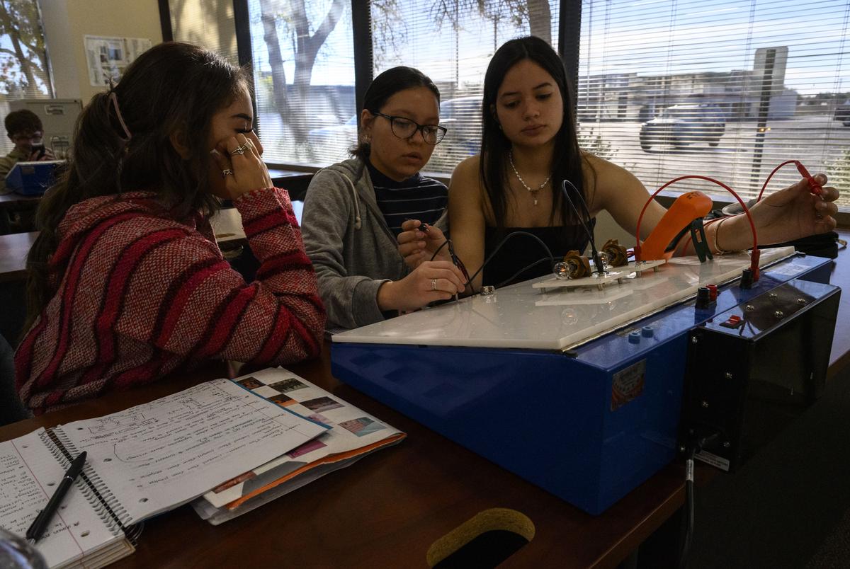 From left, high school juniors Kimberly Arredondo, 17, Elyse Alvarez, 16, and Frannevic Alcala, 16, take part in an electrical circuit activity during their Oil and Gas Production II class Monday, Nov. 6, 2023, in Midland. The Oil and Gas Production class was designed by the Midland Independent School District to teach students vocational oil and gas studies.