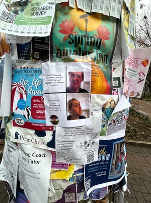 A flier at the University of Pennsylvania with a sticker reading "Freedom School for Palestine" takes the school to task for its stance on free speech and academic freedom.