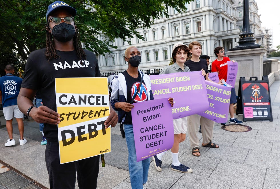 Student loan debt holders protest outside the White House staff entrance in July in Washington, D.C.