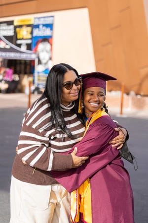Alena McQuarter receives a hug from her mother following the ASU Barrett Honors College convocation on Monday, December 11, 2023.