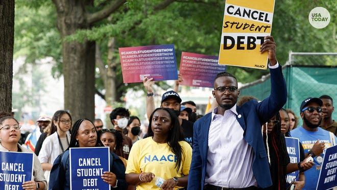 Protestors in favor of student loan forgiveness demonstrate in front of the White House after the U.S. Supreme Court struck down President Biden's student debt relief program last summer.