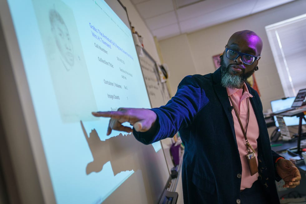 Advanced Placement courses place a big emphasis on primary-source material, and that's especially true in AP African American Studies. During a class on Feb. 15, 2024, South County High School teacher Sean Miller and students discuss sketches from the Amistad rebellion.