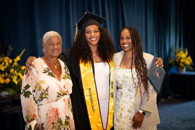 Kayanna Harris with her mom and sister, who joined the chemical engineering graduate on stage on May 13 at UC Berkeley's MLK, Jr. Student Union.