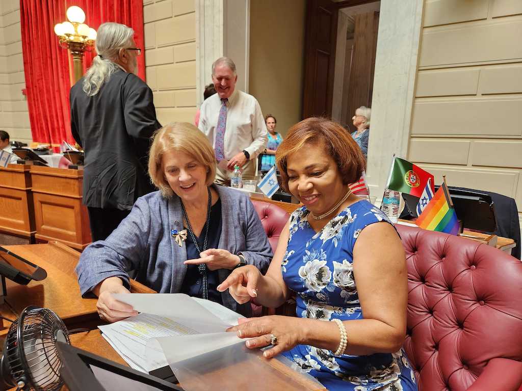 Two women lawmakers at the Rhode Island Capitol.