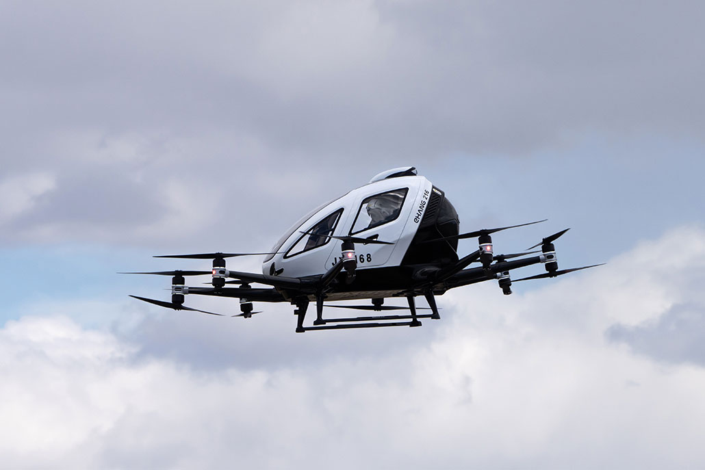 a flying car in the sky with multiple horizontal propellers for lift