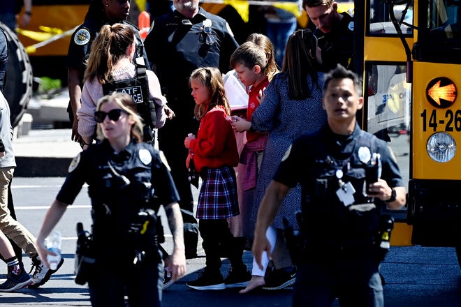 Students from the Covenant School disembarking a bus to reunite with parents at Woodmont Baptist Church in Nashville, Tennessee.